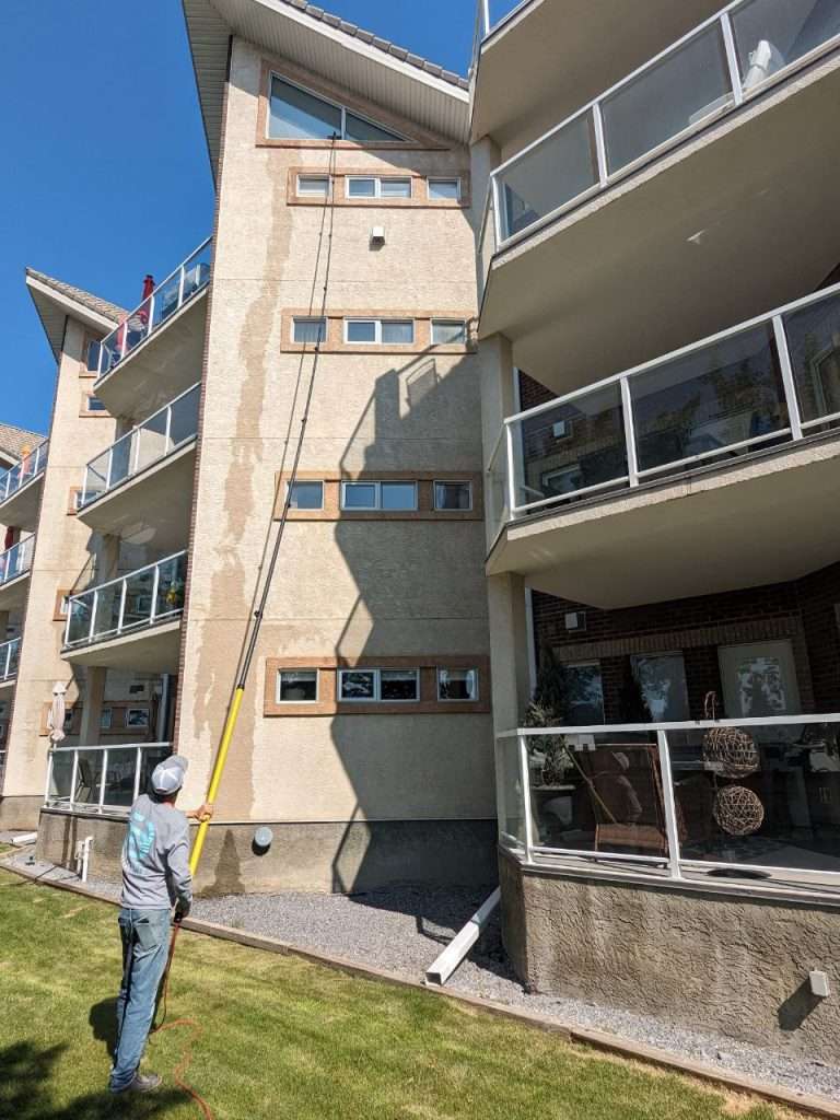 Darrell a SurfacePro technician cleaning windows in Medicine Hat